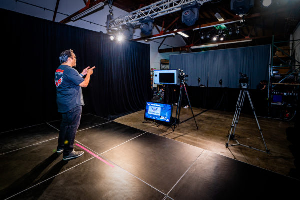 Film and photo set-up with key lights and backdrop