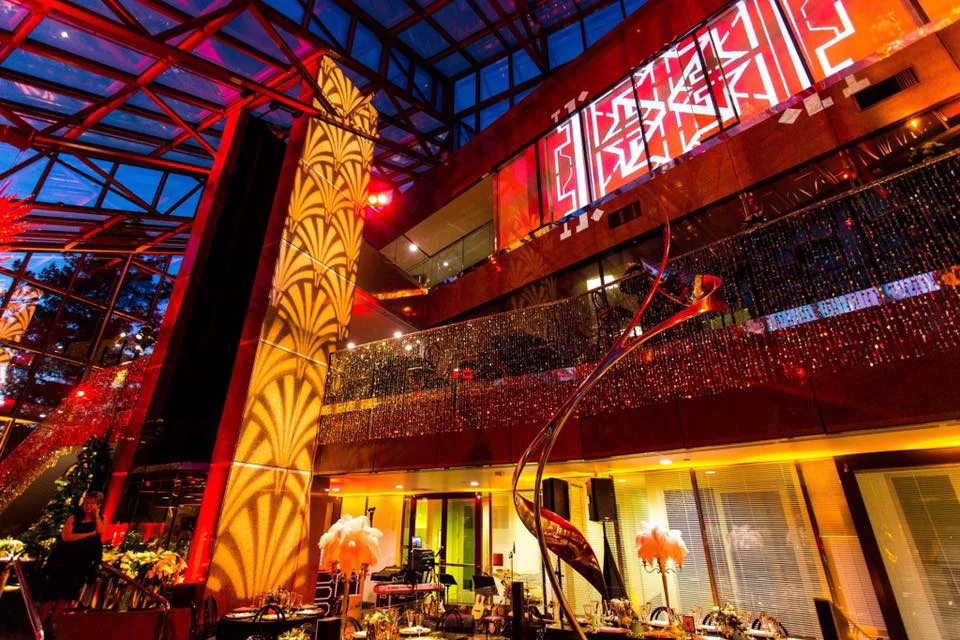 Complete venue lighting, wall pattern wash, and dining set up for corporate event