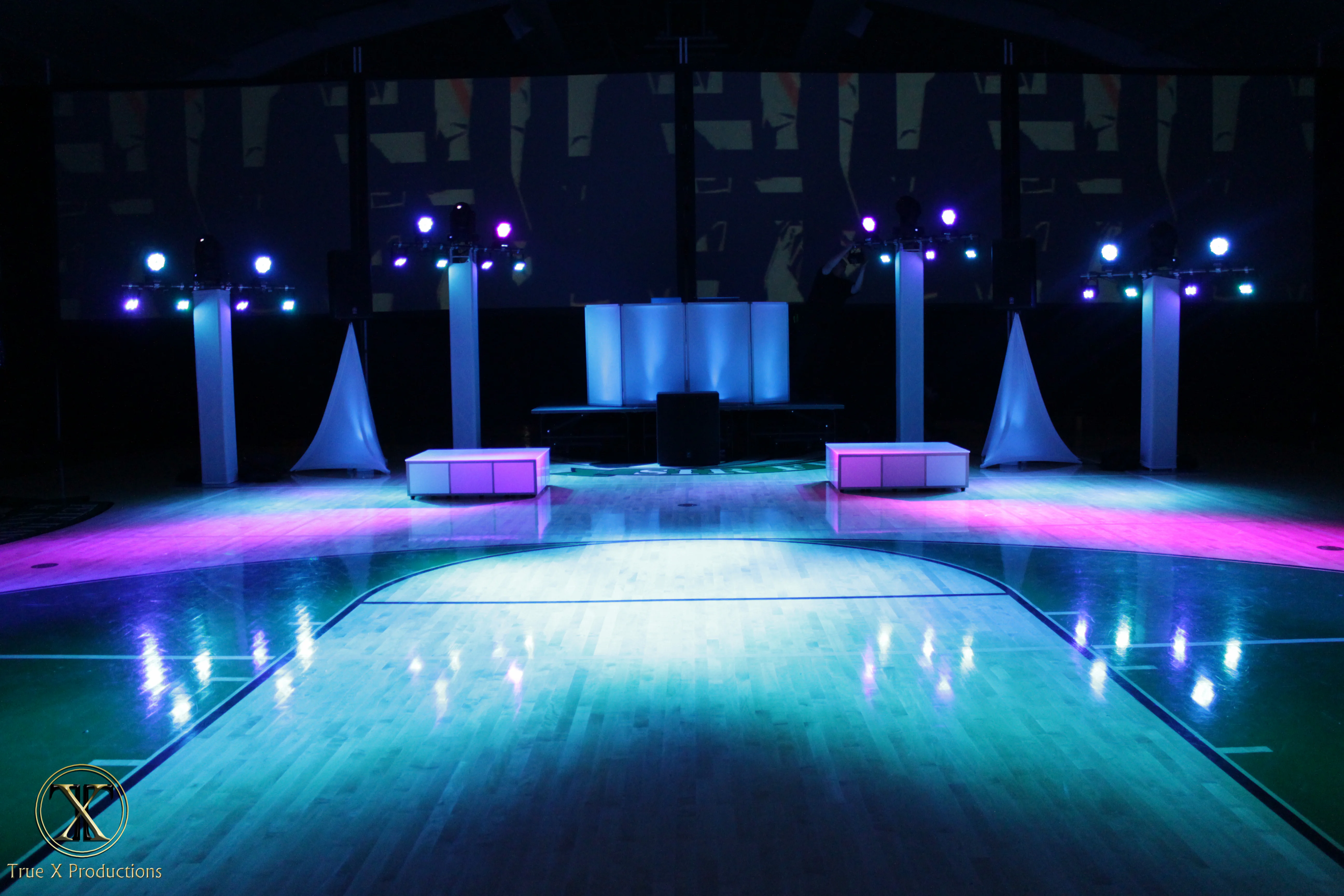 Basketball court lighting, multicolored lighting, and stage lighting for corporate event