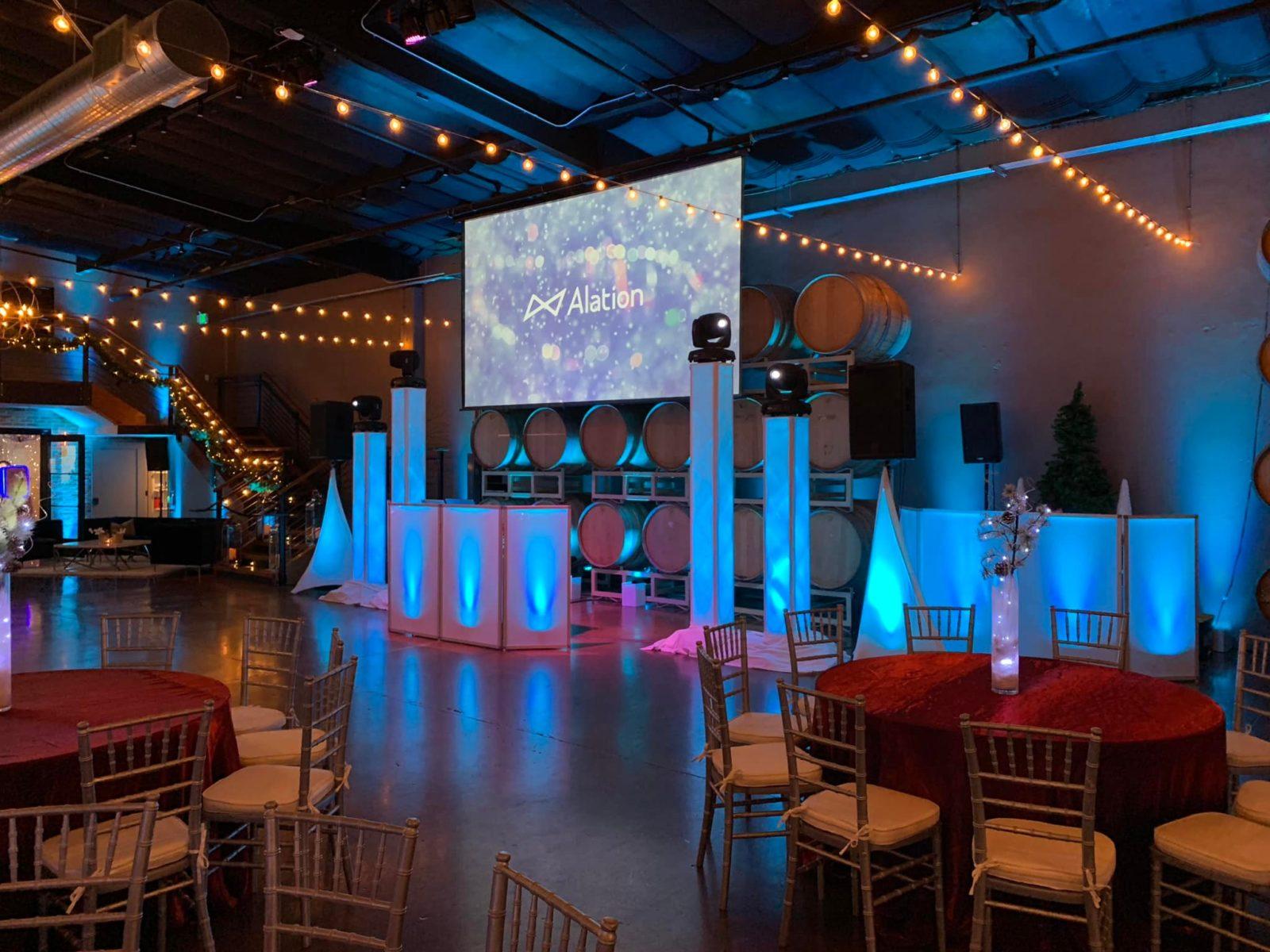 DJ booth lighting and string lights for wedding