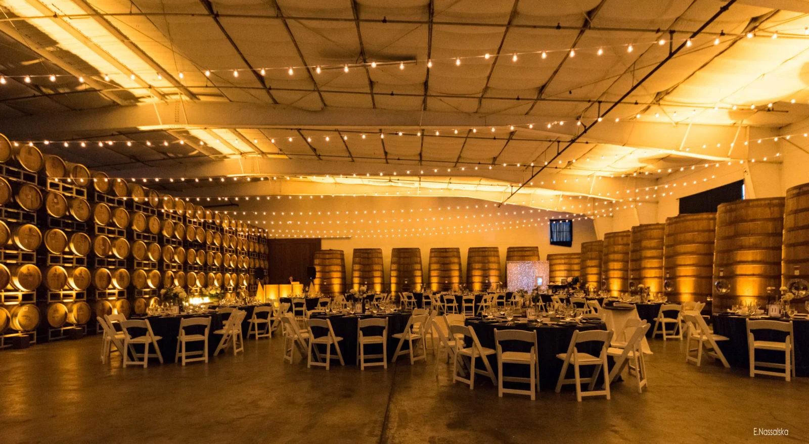 indoor string lights and up lighting for private dinner