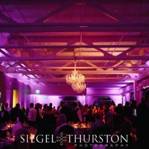 Ambient lighting, candle light and chandelier lighting for wedding