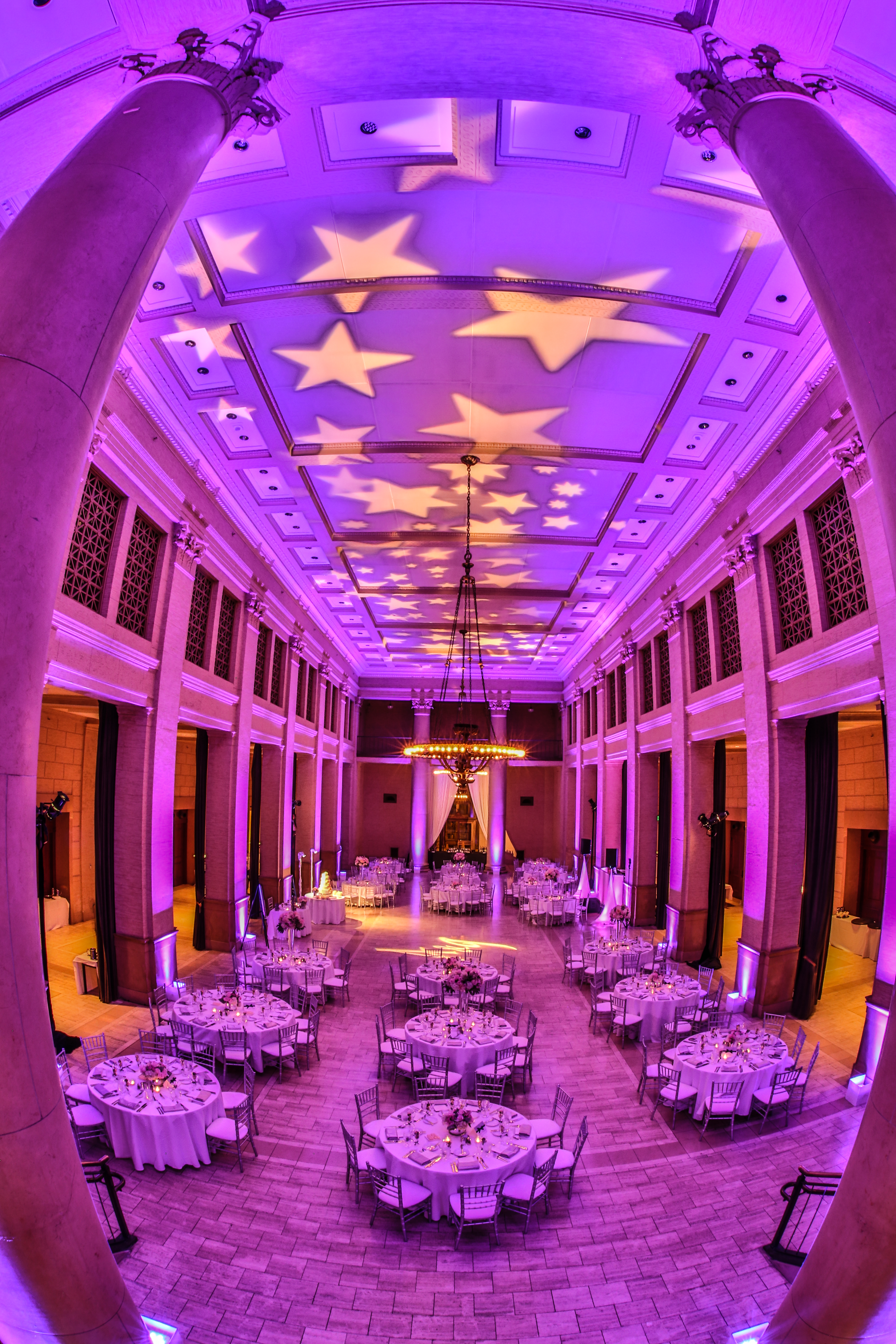 Monogram lighting for entire venue with dining set-up
