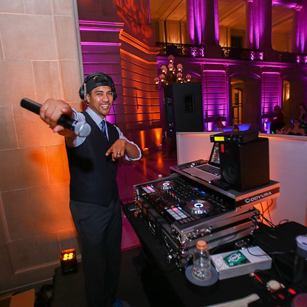 Back stage DJ set-up with multicolored venue lighting